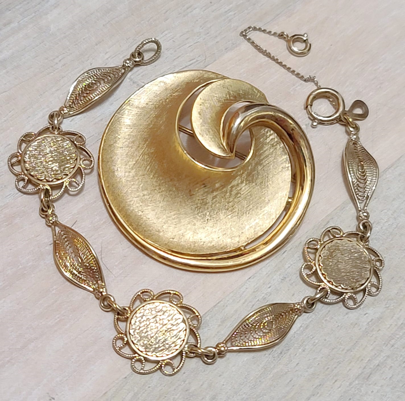 Vintage Trifari swirl pin and 14K gold plated filigree Amco bracelet