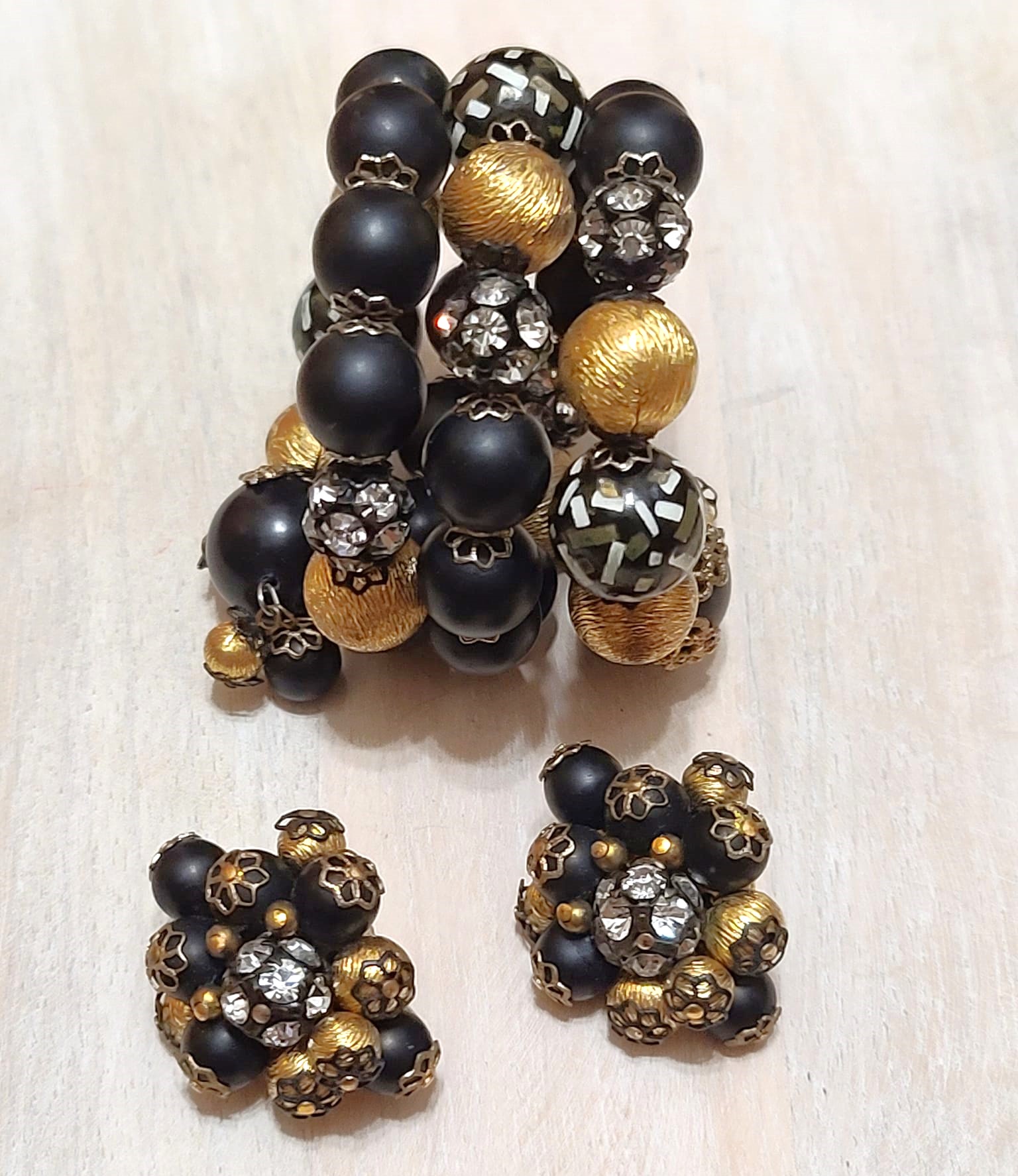 Designer Hobe rhinestone and bead memory wire bracelet and clip on earrings black,confetti,gold