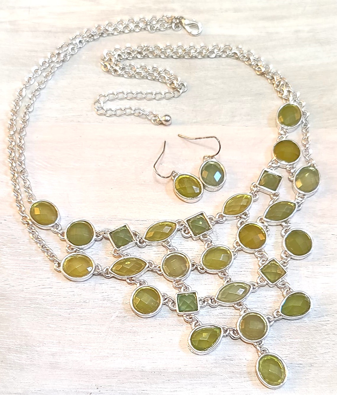 Green cabachon bib necklace, fashion necklace and matching earrings, green faceted hues