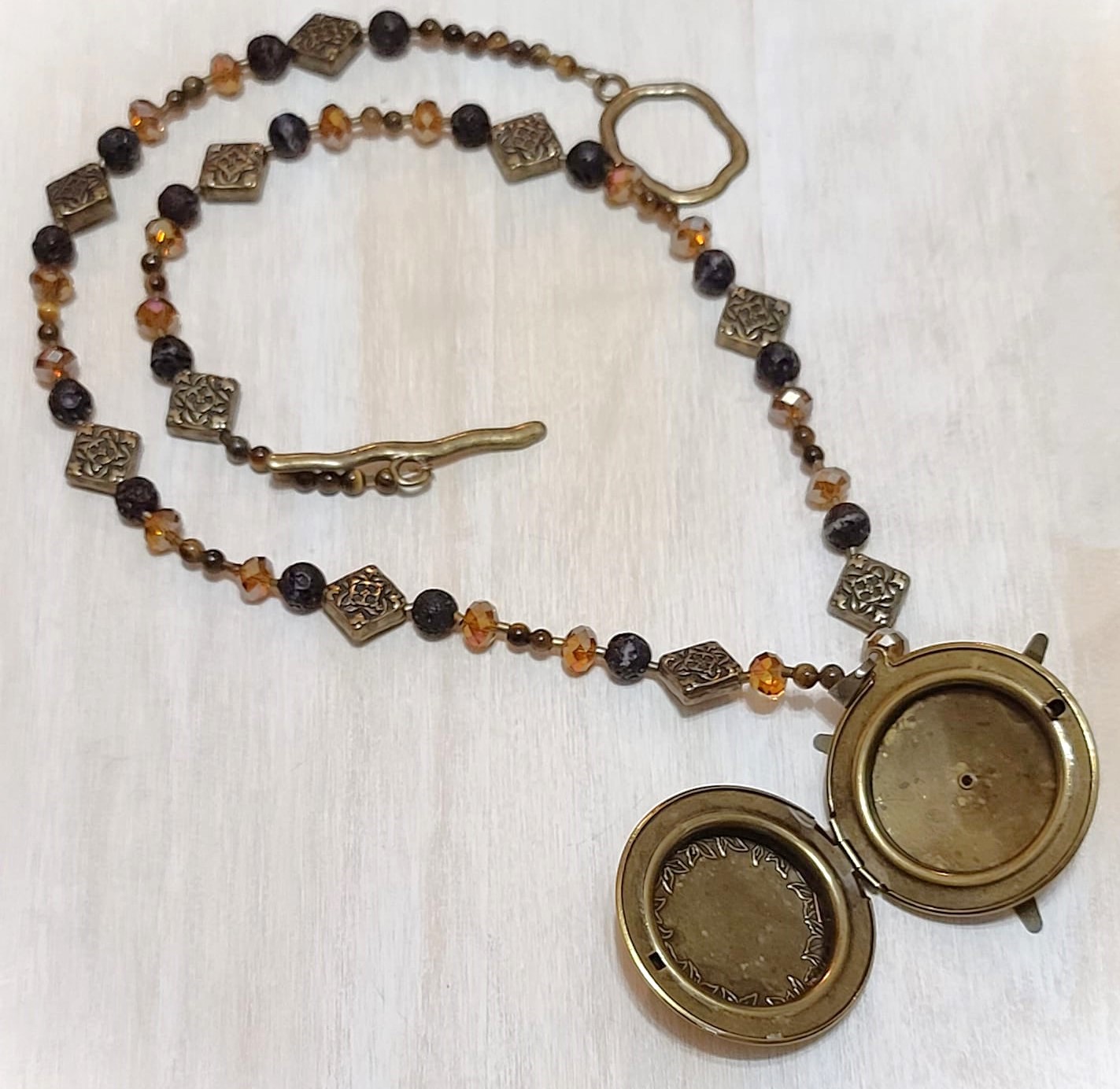 Gemstone locket necklace, lava rock, crystals and tiger eye
