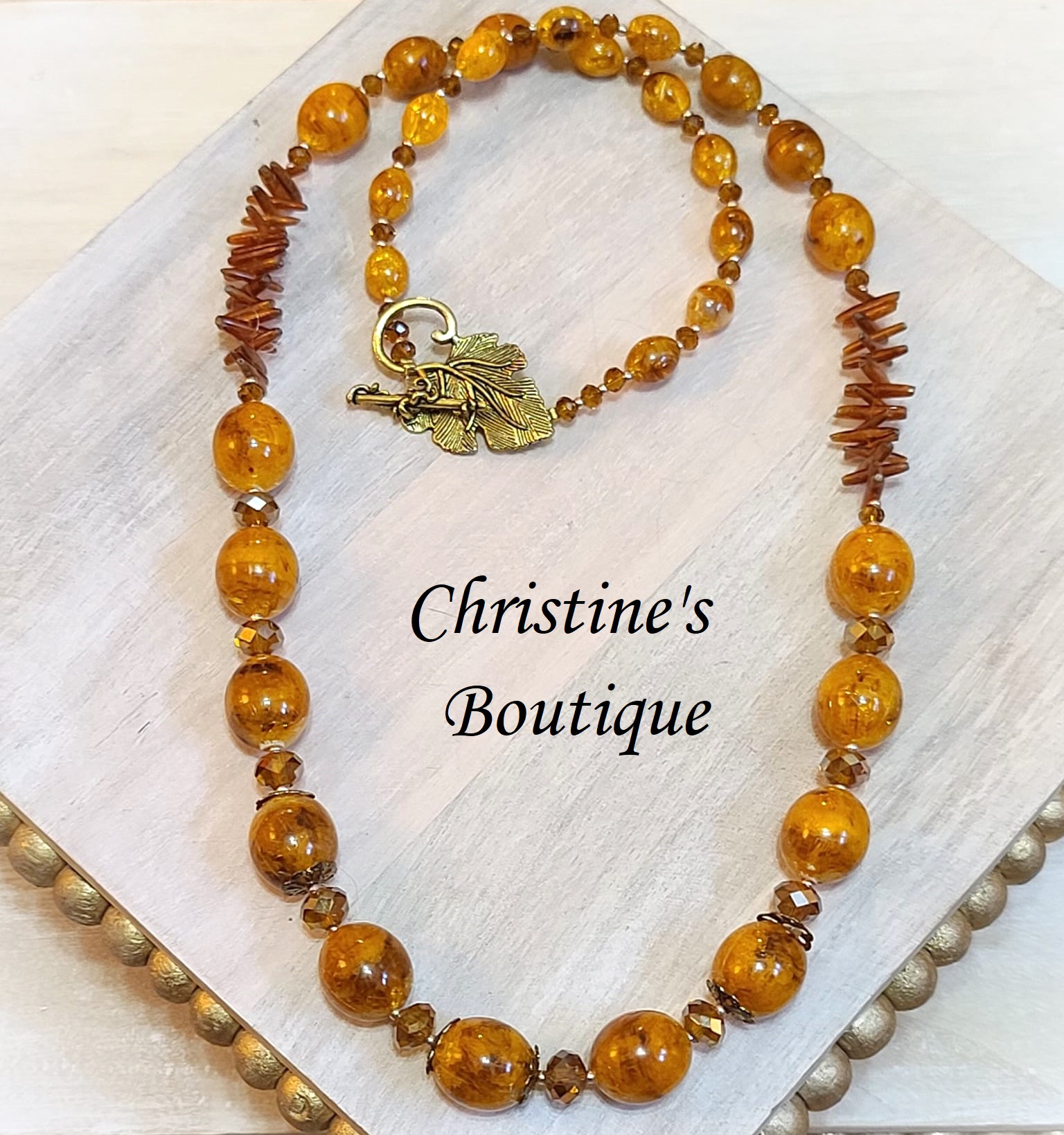 Handcrafted necklace, butterscotch swirled beads, crystal, coral - Click Image to Close