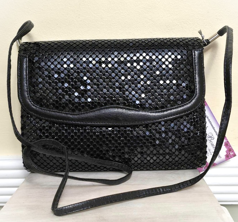 Black handbag, black metal disks, over the shoulder handbag designer Nylites