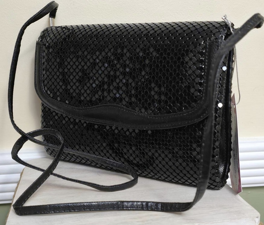 Black handbag, black metal disks, over the shoulder handbag designer Nylites