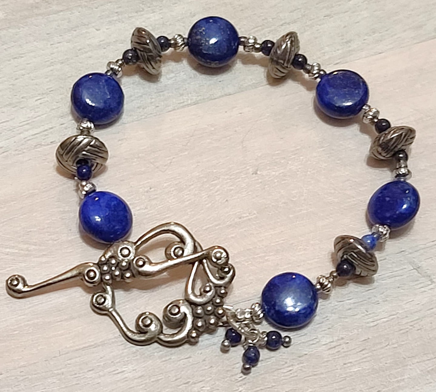 Blue lapis bracelet, bali silver, ornamental grape leaf clasp