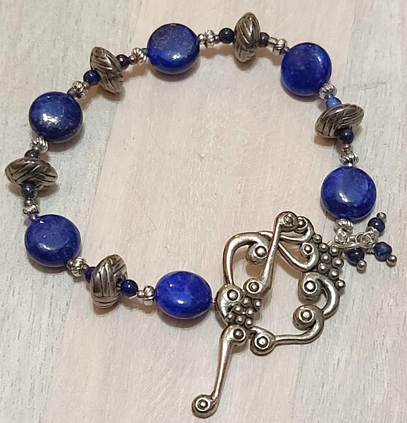Blue lapis bracelet, bali silver, ornamental grape leaf clasp
