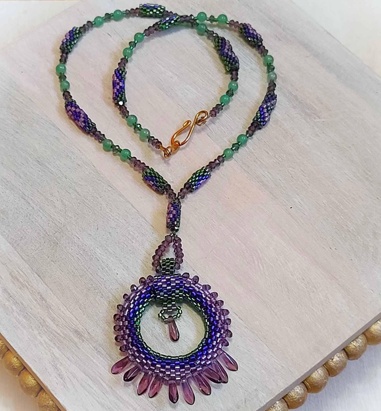 Beaded pendant necklace with fringe, circle pendant, jade gems