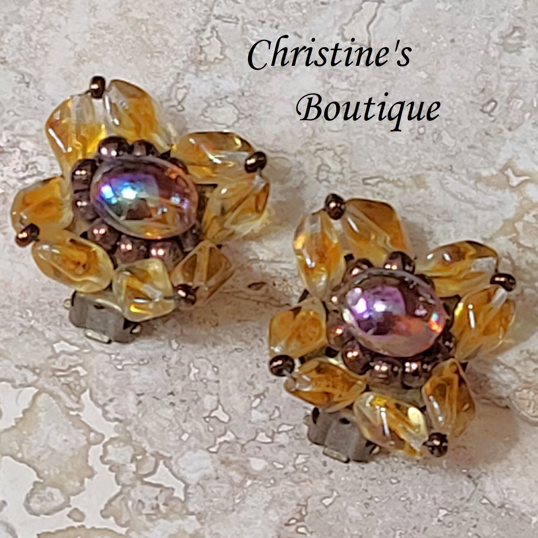 Vintage clip on earrings, carnival iridescent center with gold beads