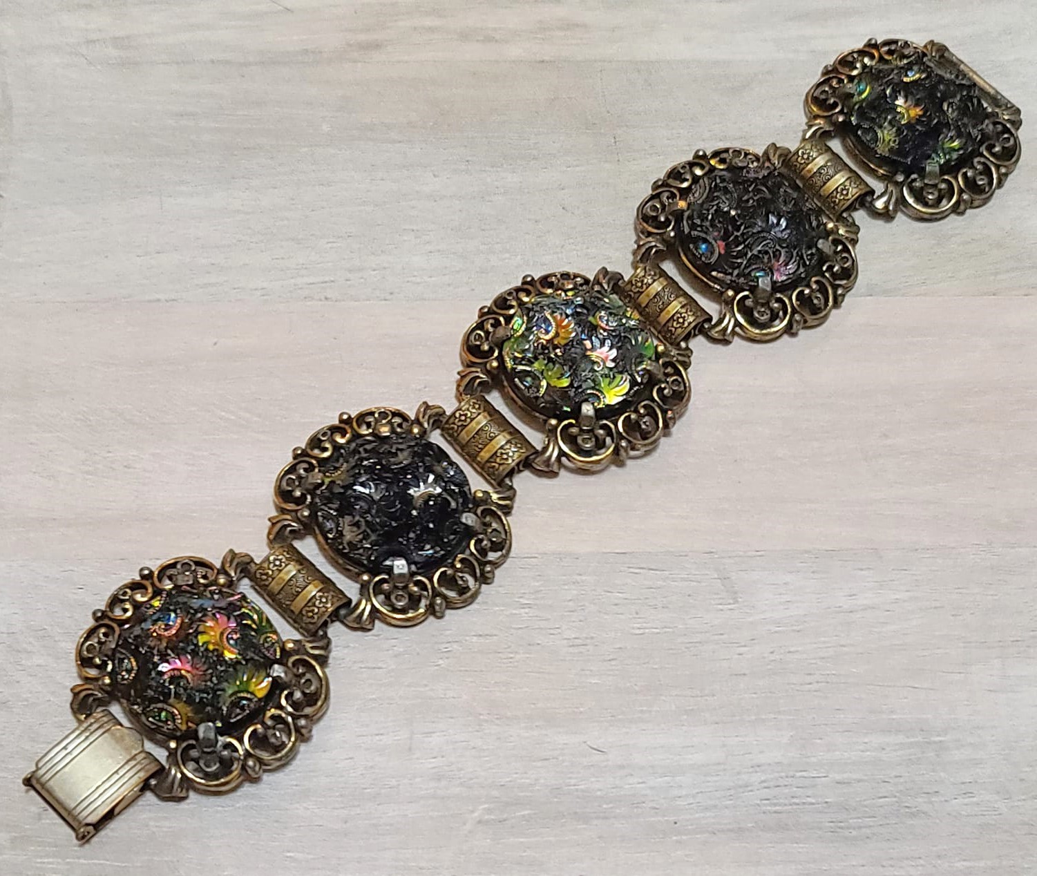Judy Lee bracelet, designer signed, ornate iridescdent black and carnival cabachons