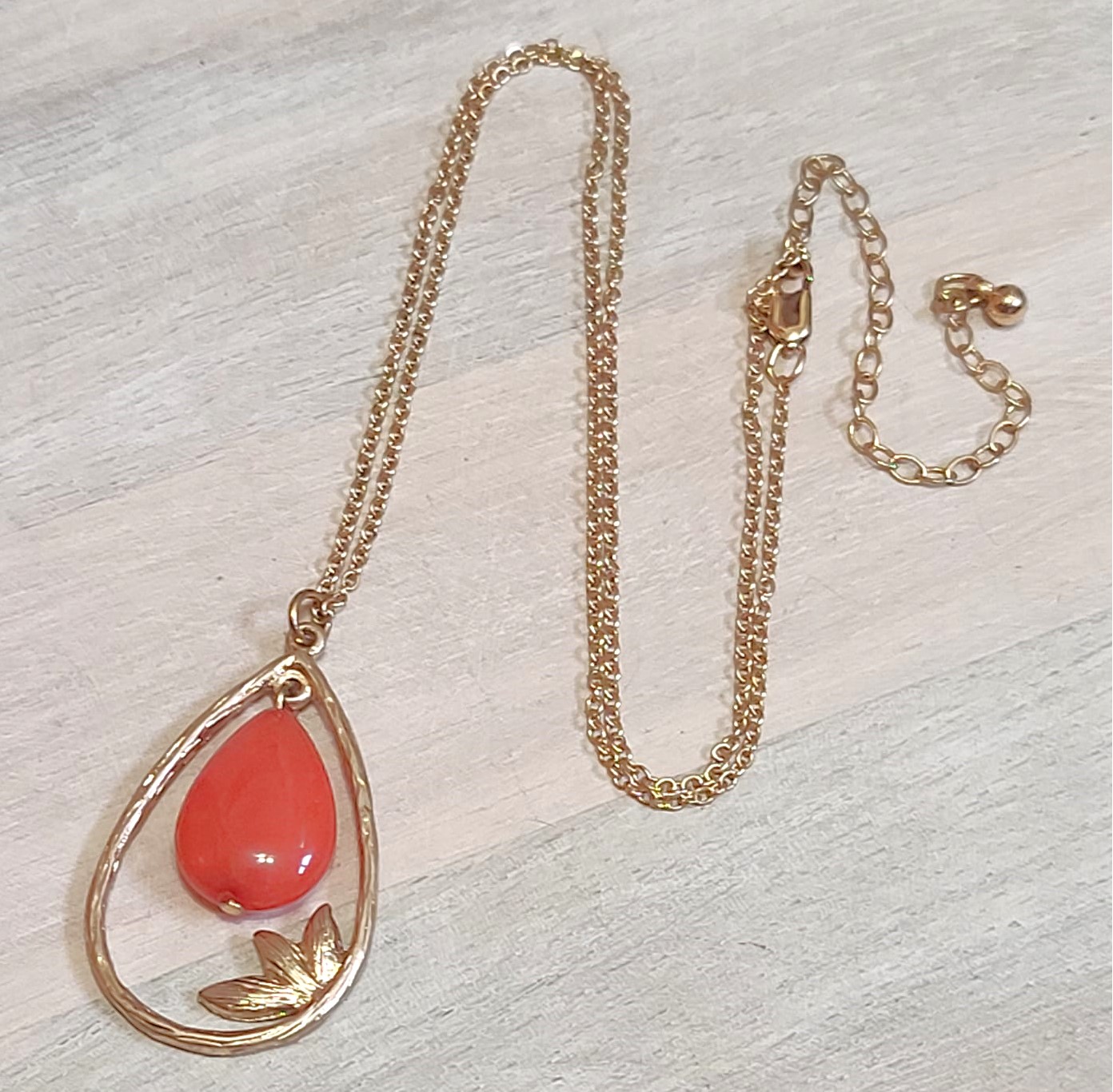 Gemstone pendant necklace, coral orange dyed quartz, with leaf pattern on chain