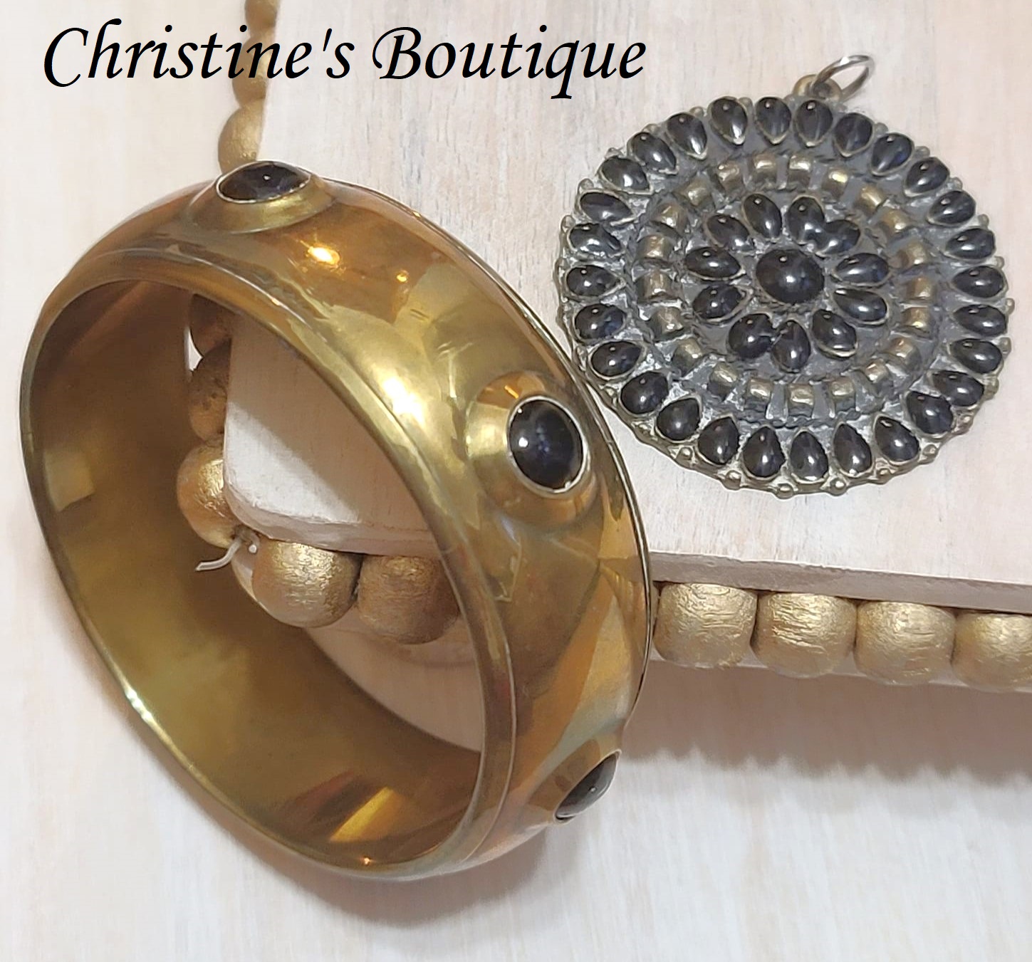 Brass bangle bracelet with black cabachons and matching pendant, vintage set