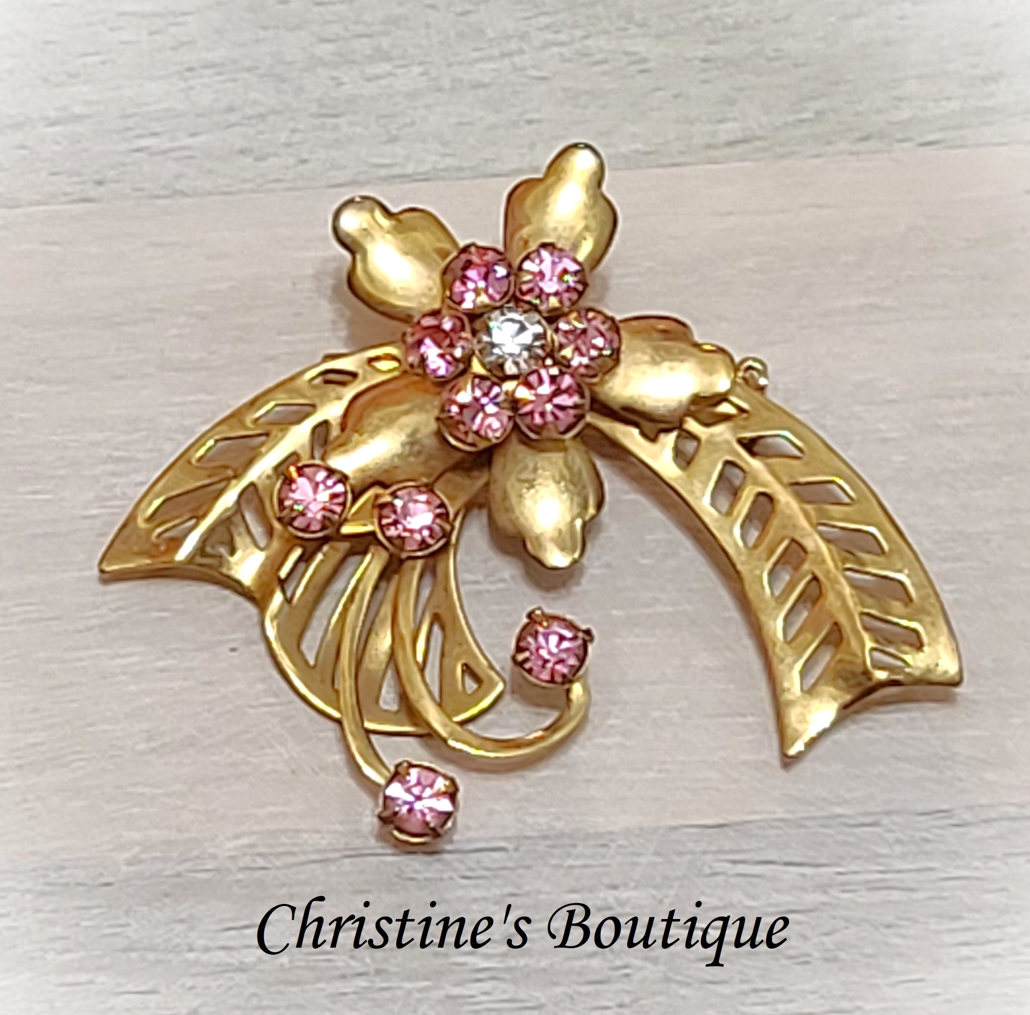 Pink Rhinestone Goldtone Scrolled Design Pin