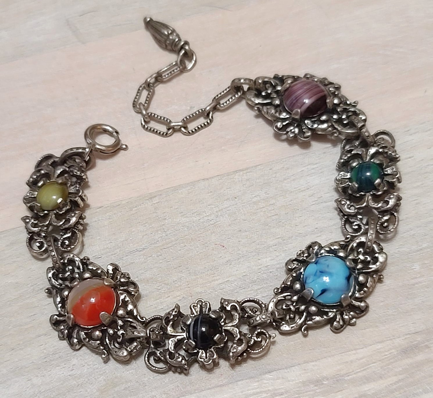 Vintage ornate bracelet, with multi color cabachons and filigree metal