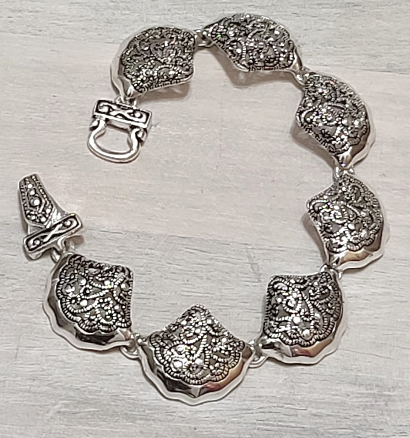 Filigree bracelet, shell shaped links