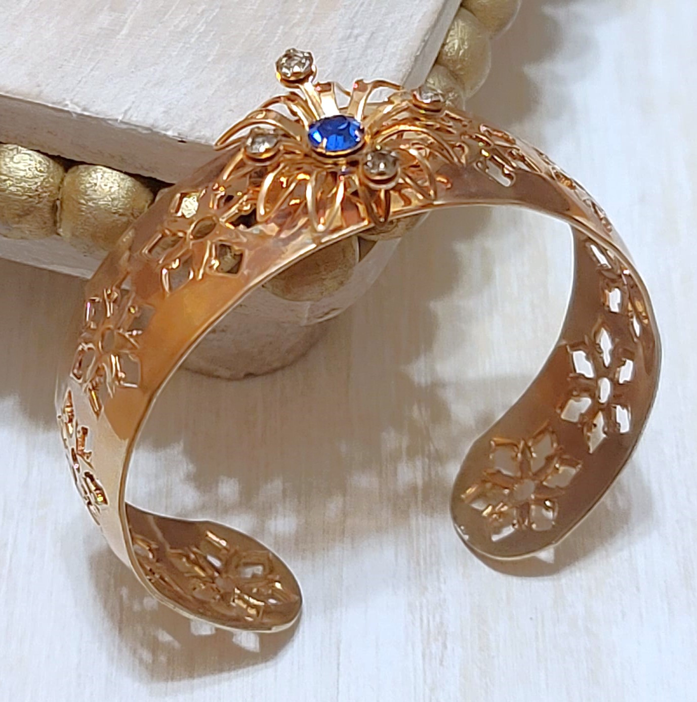 Copper cuff bracelet with cutout design with blue and white rhinestones, vintage bracelet