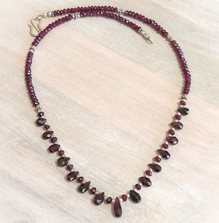 Garnet gemstone necklace, tear drop stones, with sterling silver accents and clasp