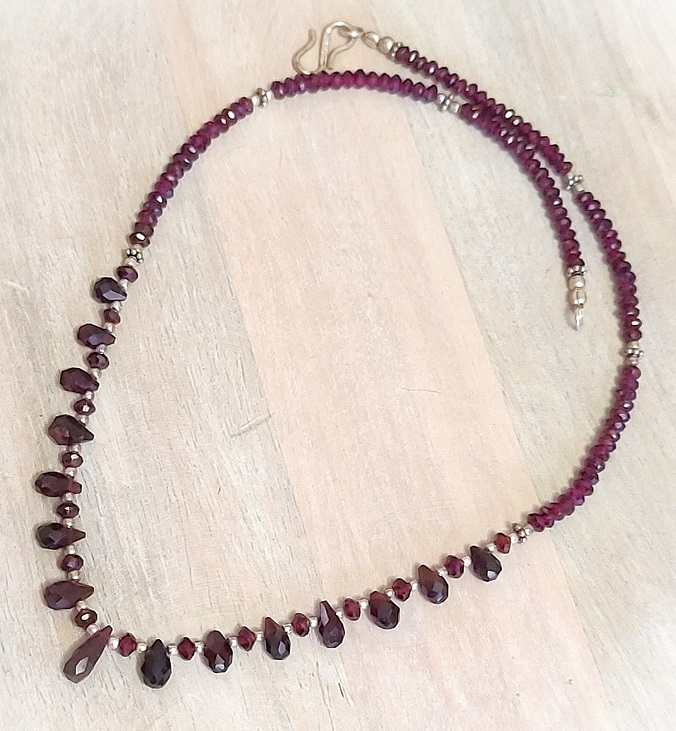 Garnet gemstone necklace, tear drop stones, with sterling silver accents and clasp