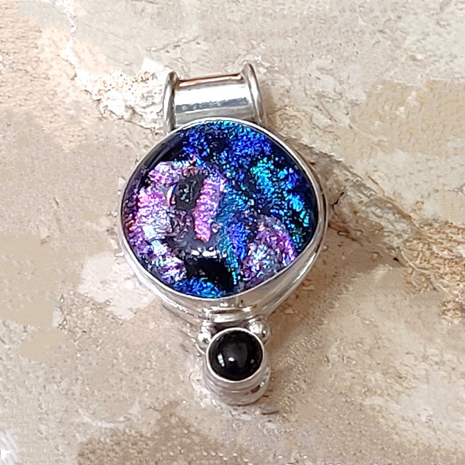 Dichroic glass pendant with black onyx set in 925 sterling silver