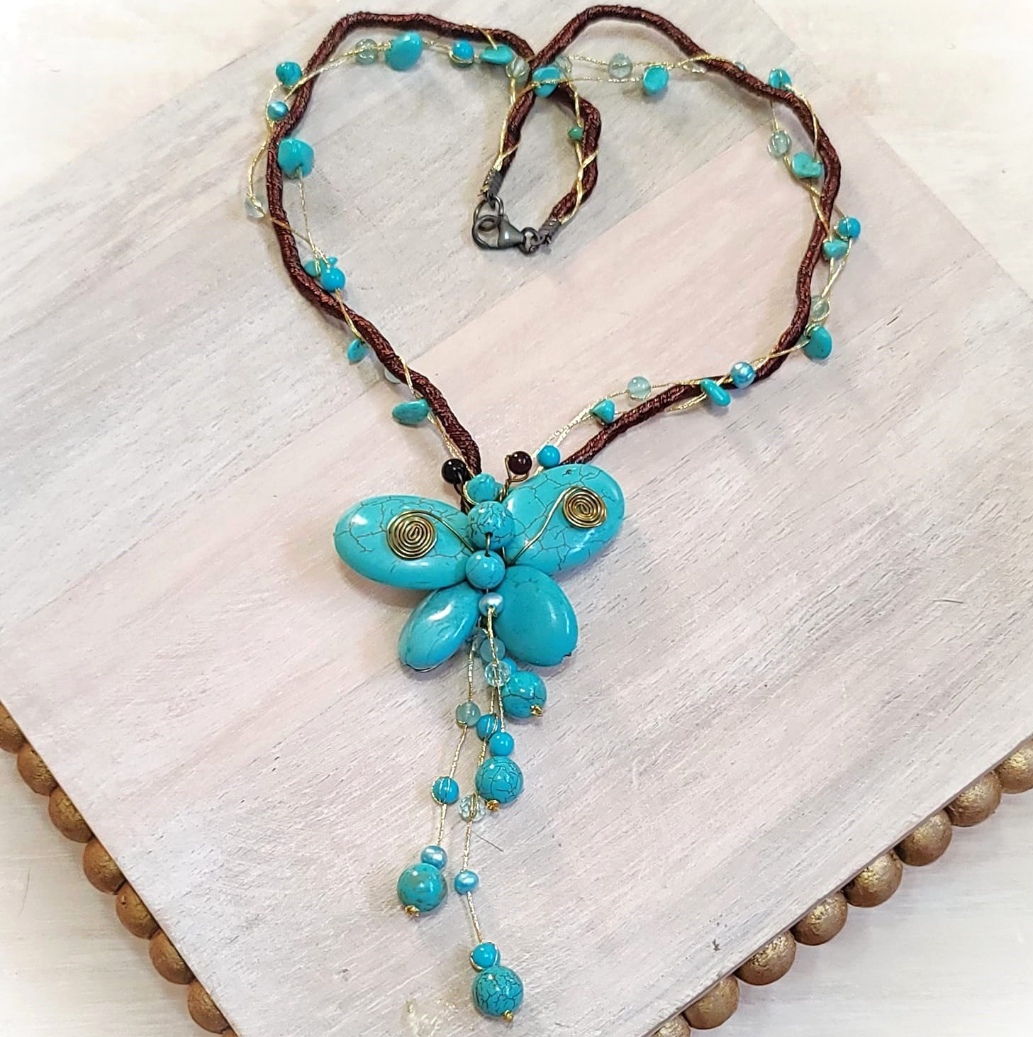 Turquoise howlite butterfly lariat on silk cording