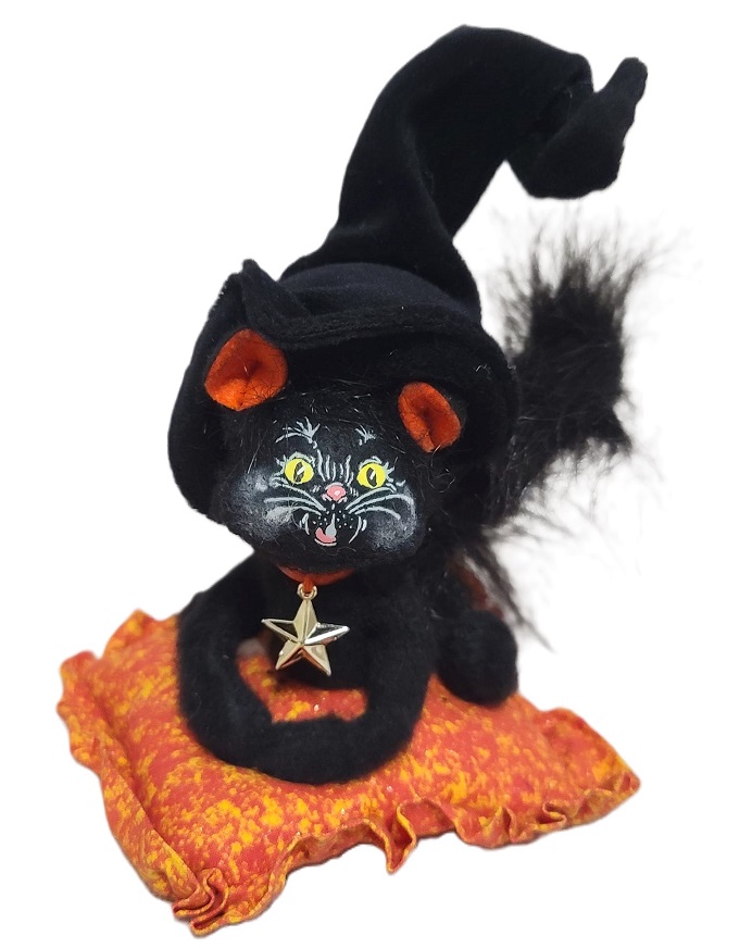 Annalee Halloween black cat sitting on an orange blanket