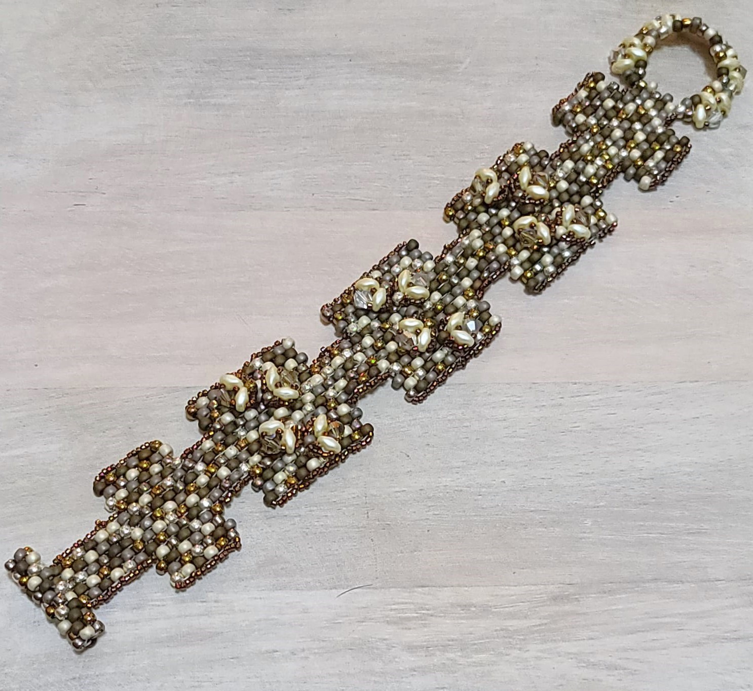 Metallic glass golds and silvers raised design bracelet
