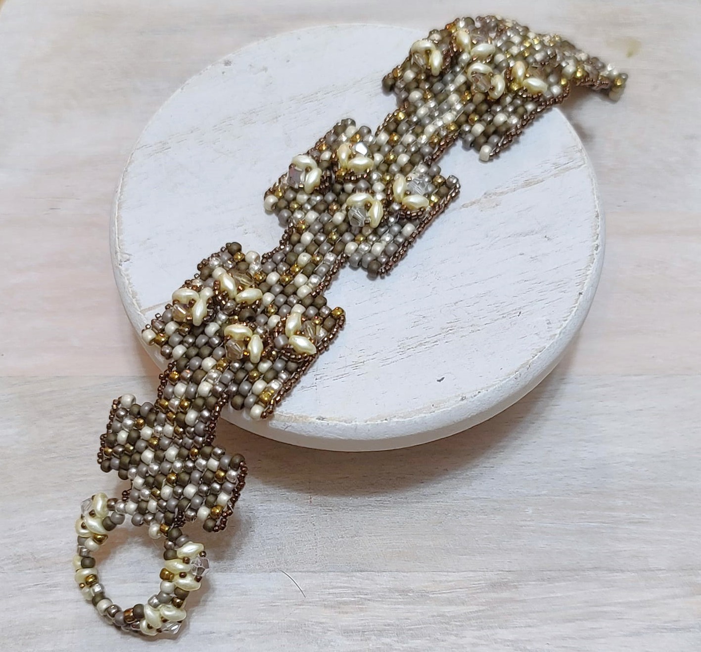 Metallic glass golds and silvers raised design bracelet