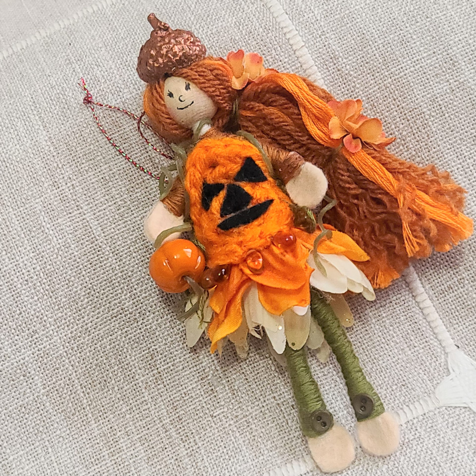 Halloween doll with pumpkin and vines