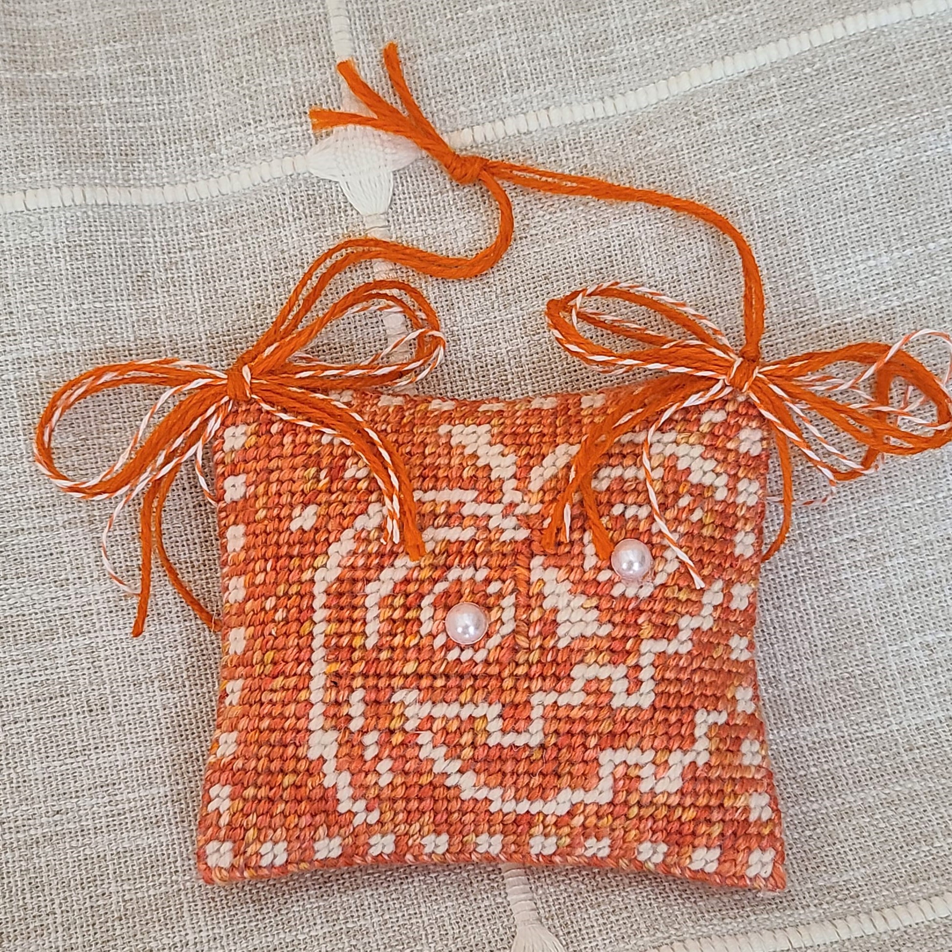Halloweeen needlepoint pumpkin with pearl eyes ornament