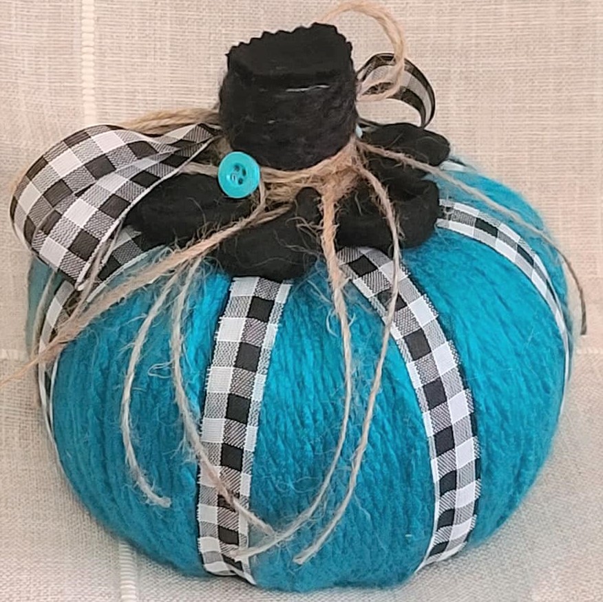 Teal yarn tabletop pumpkin with gingham and jute bow