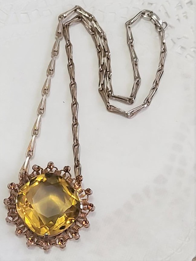 Amber Glass Cut Center Stone Surrounding Rhinestones Necklace
