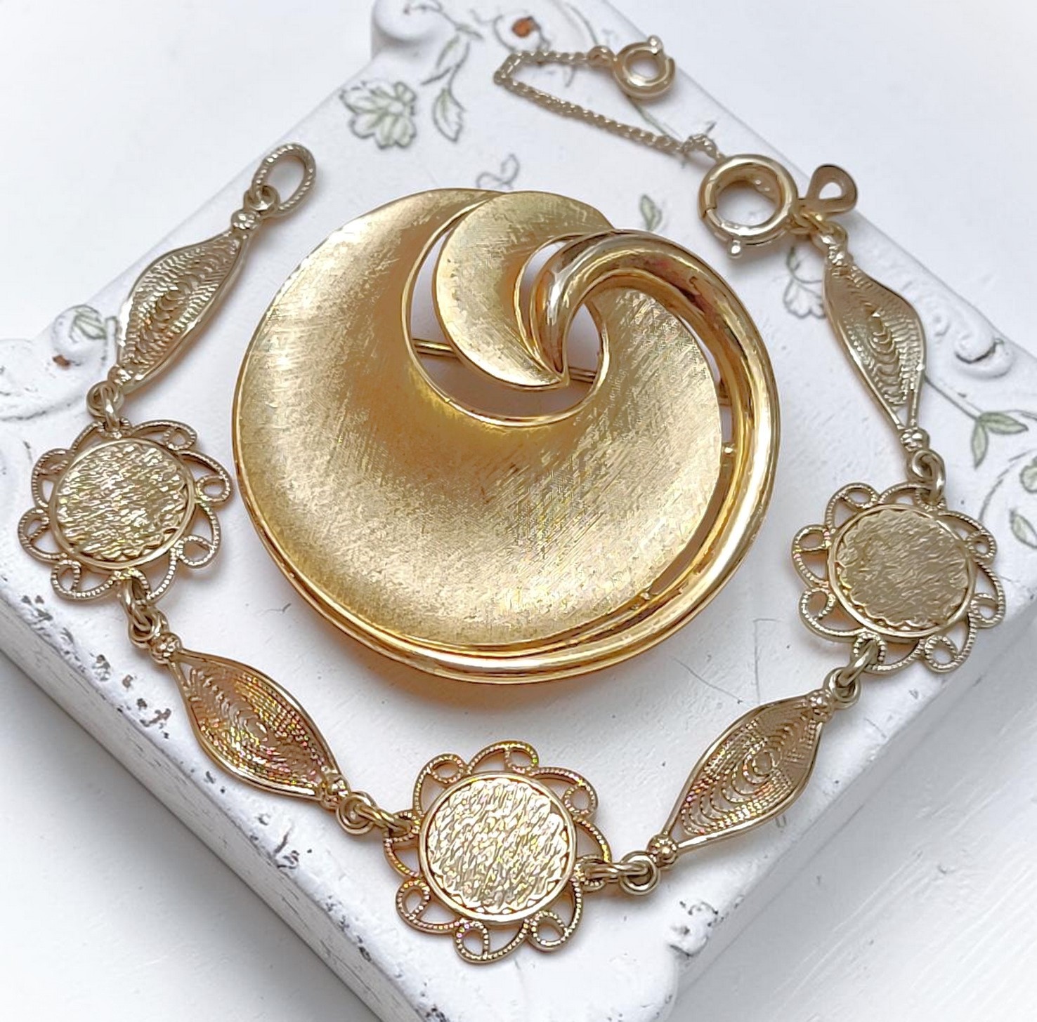 Vintage Trifari swirl pin and 14K gold plated filigree Amco bracelet