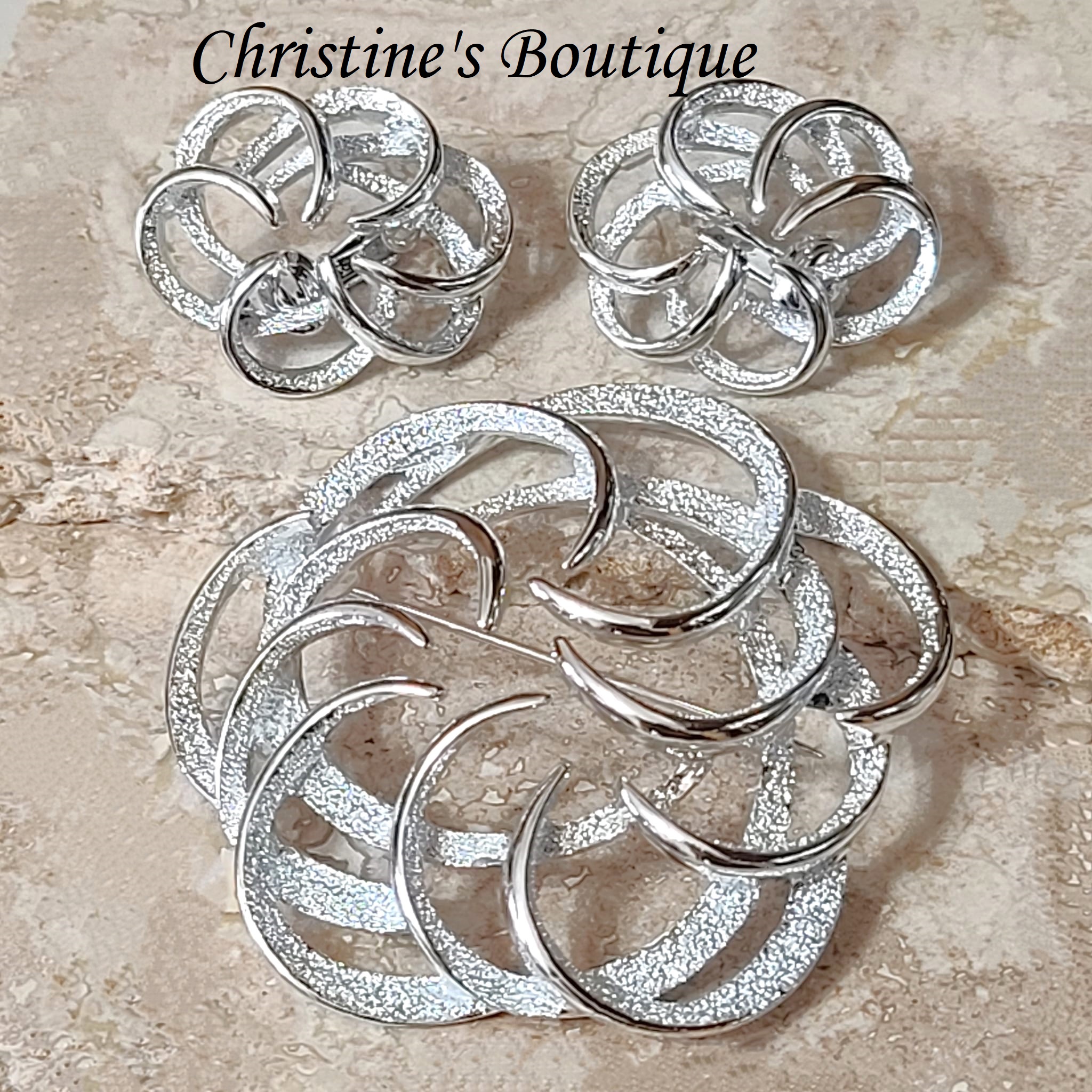 Sarah Coventry pin set, brooch and clip on earrings, silver barnished swirl pin and earrings