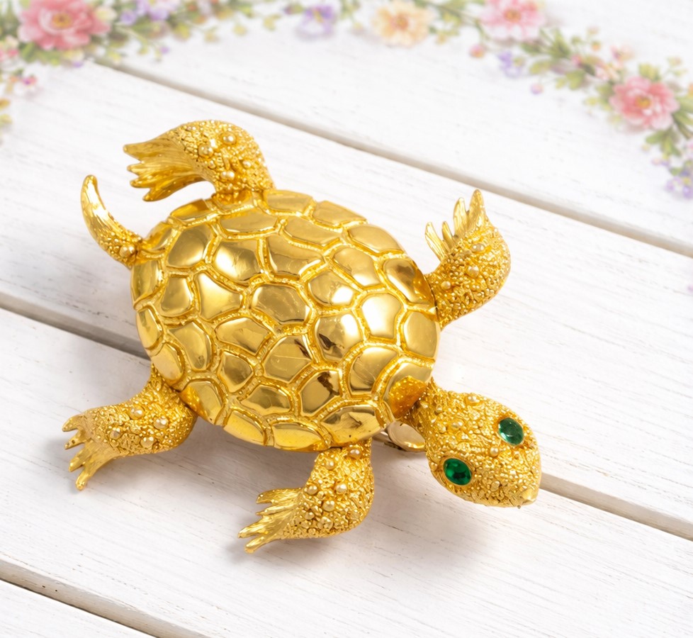 Turtle vintage pin with green rhinestone eyes