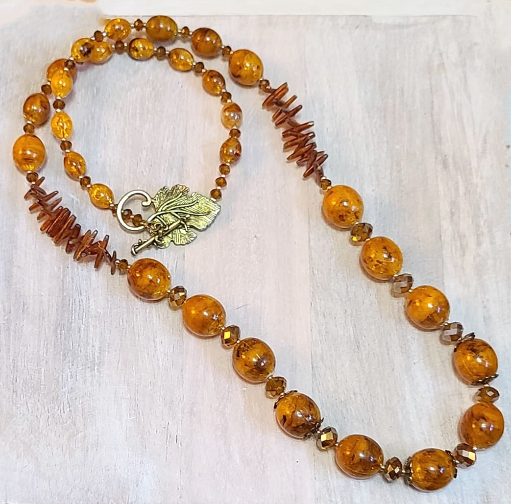 Handcrafted necklace, butterscotch swirled beads, crystal, coral