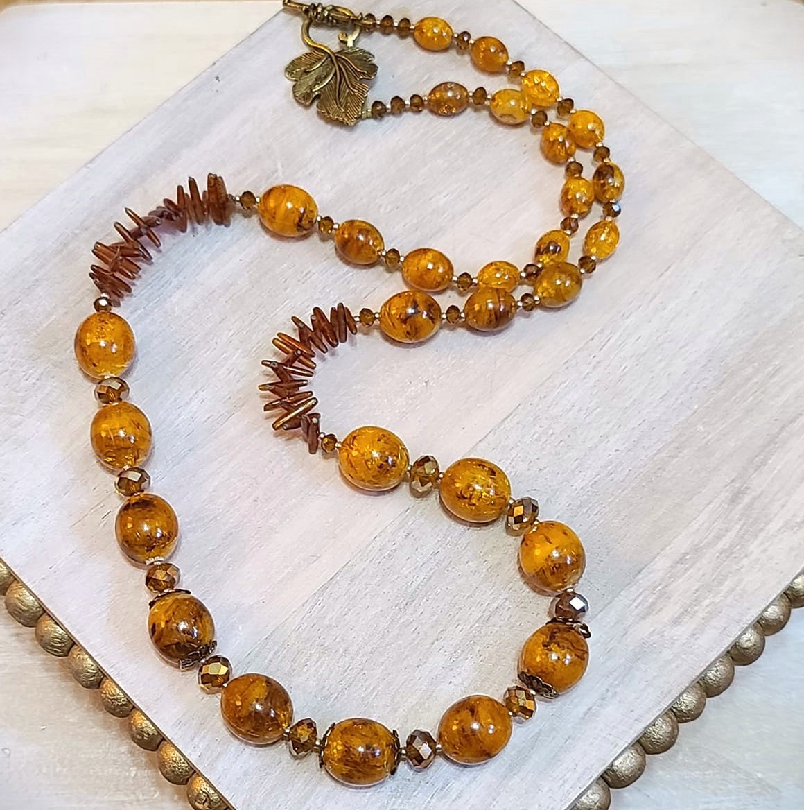 Handcrafted necklace, butterscotch swirled beads, crystal, coral