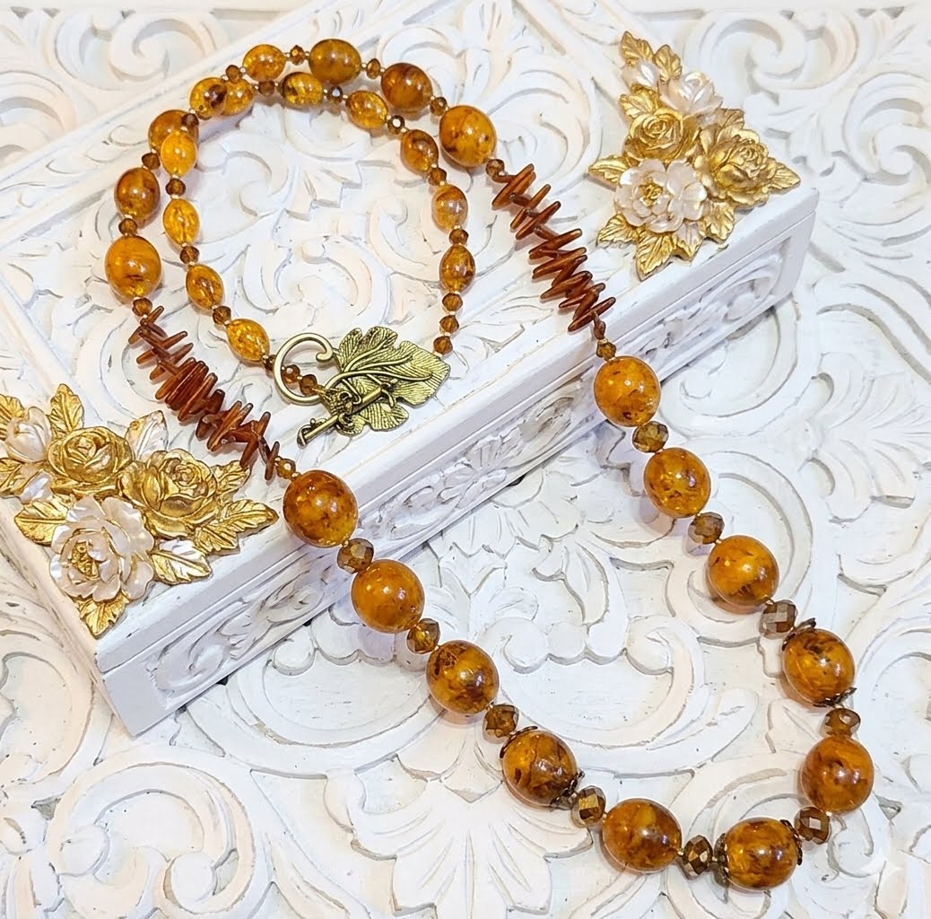 Handcrafted necklace, butterscotch swirled beads, crystal, coral