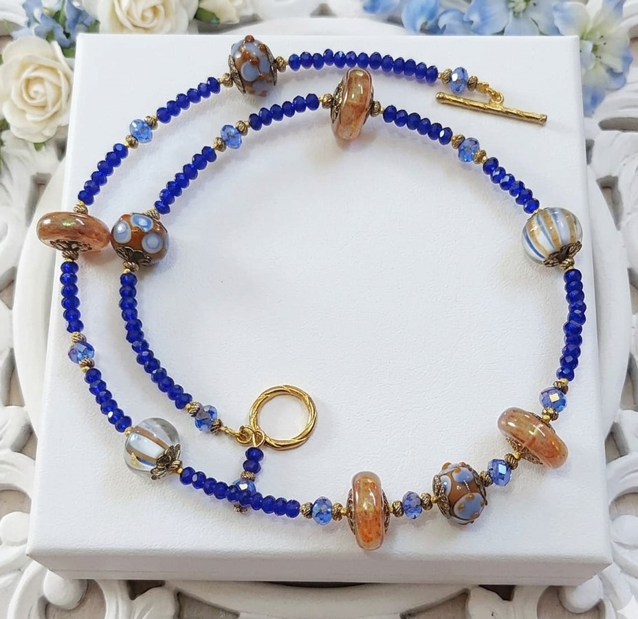 Lampwork glass necklace, blues and tawny brown with cyrstals