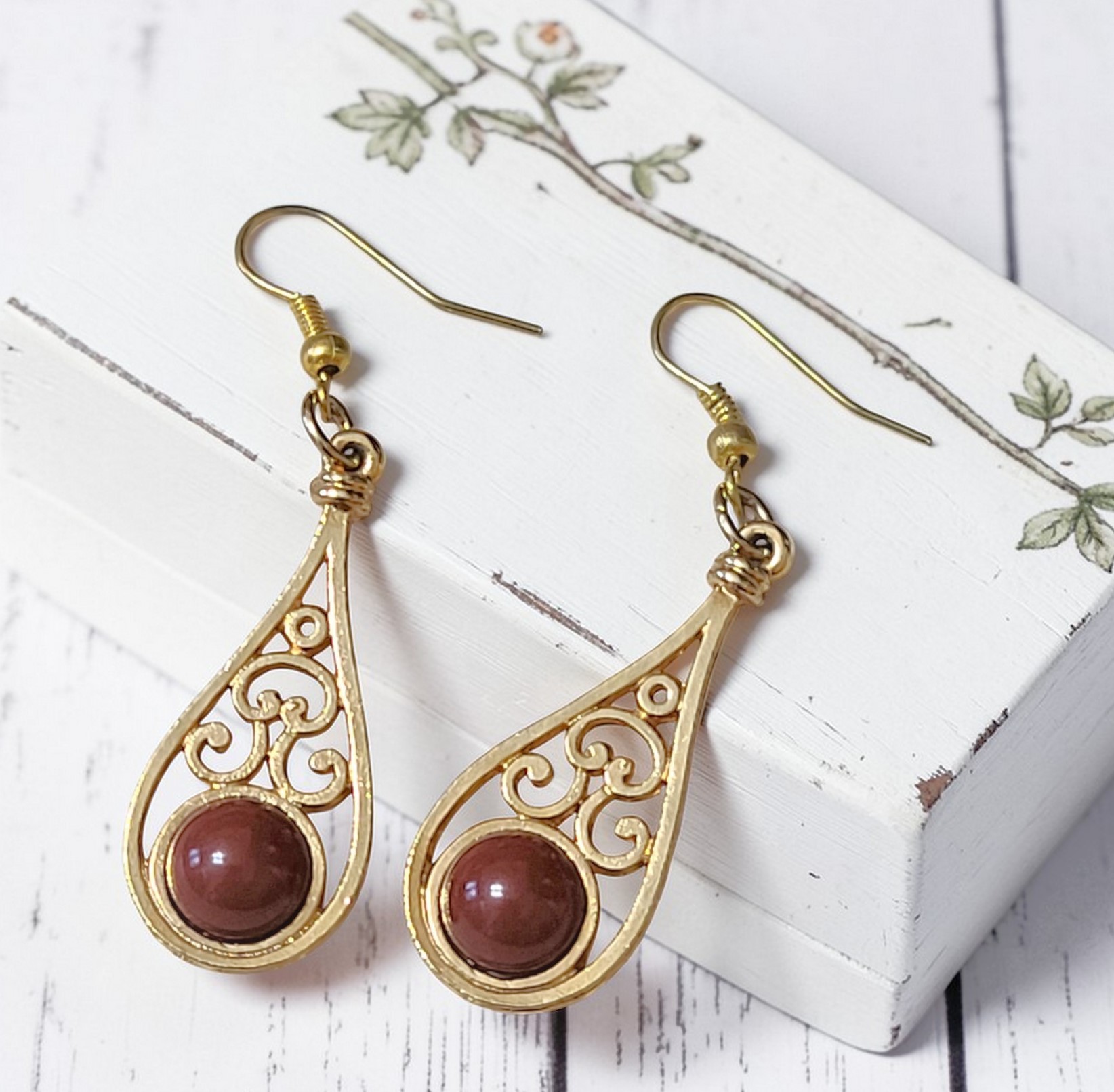 Coro dangle earrings, pierced, vintage with dark red cabachon