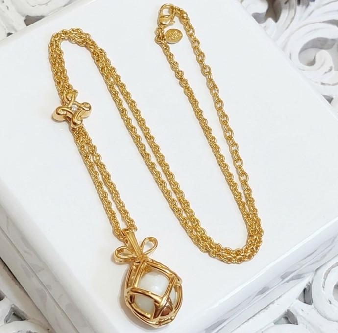 Joan Rivers necklace, adjustable lariat, open egg pendant with white faceted inside