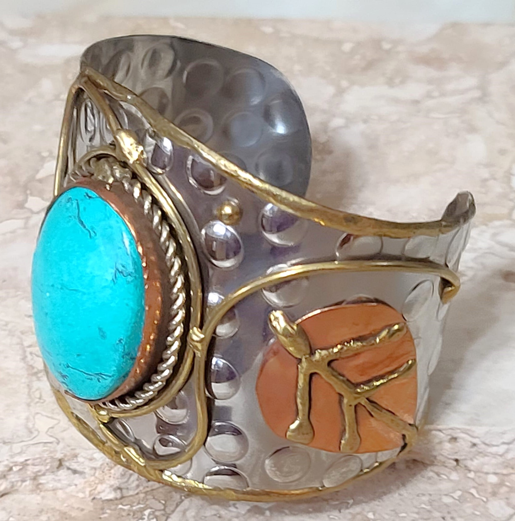 Cuff bracelet, with center howlite gemstone, tri color metals, copper, silver and brass