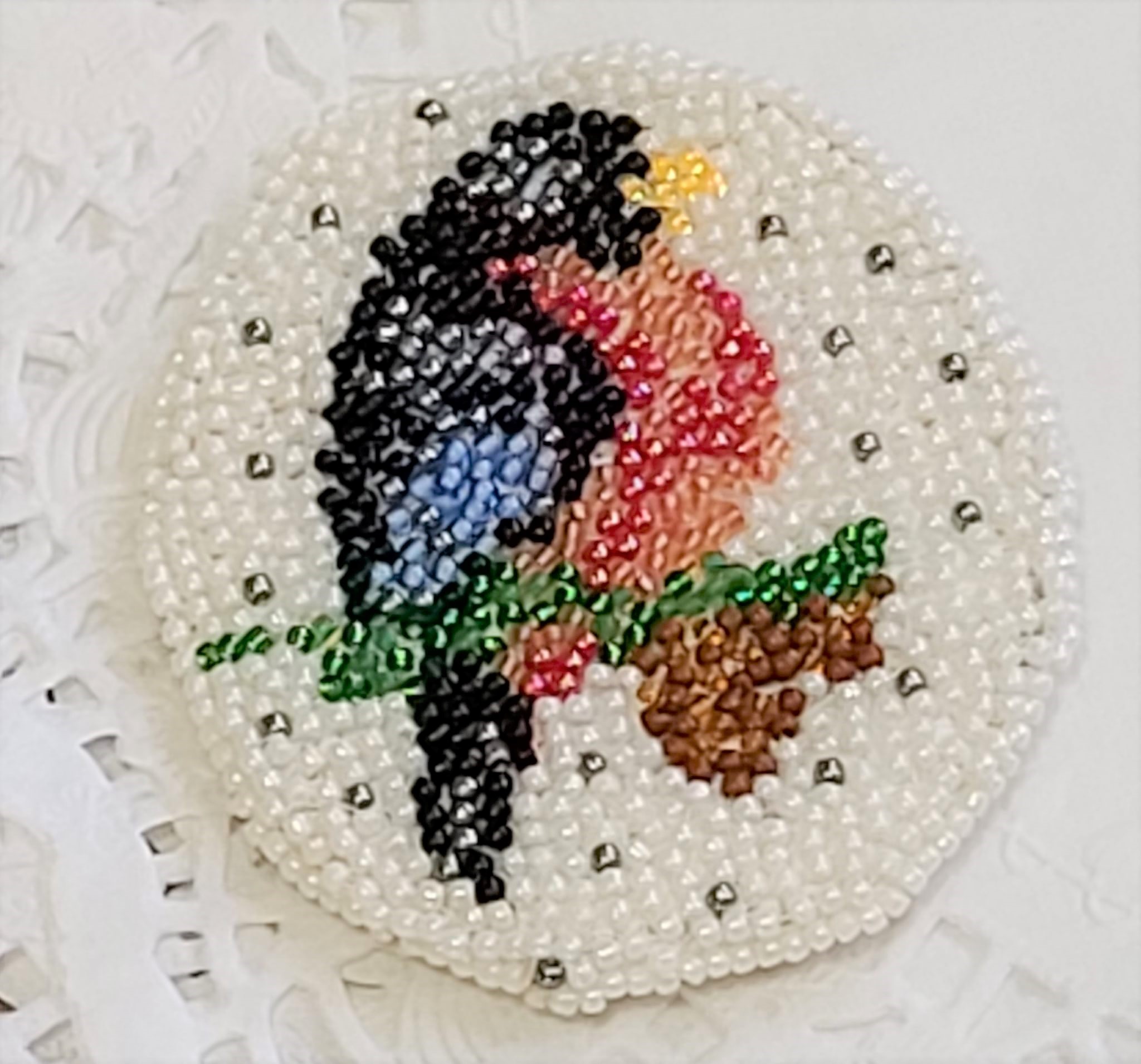 Hand beaded bird on a branch brooch