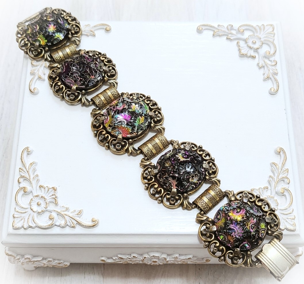Judy Lee bracelet, designer signed, ornate iridescdent black and carnival cabachons