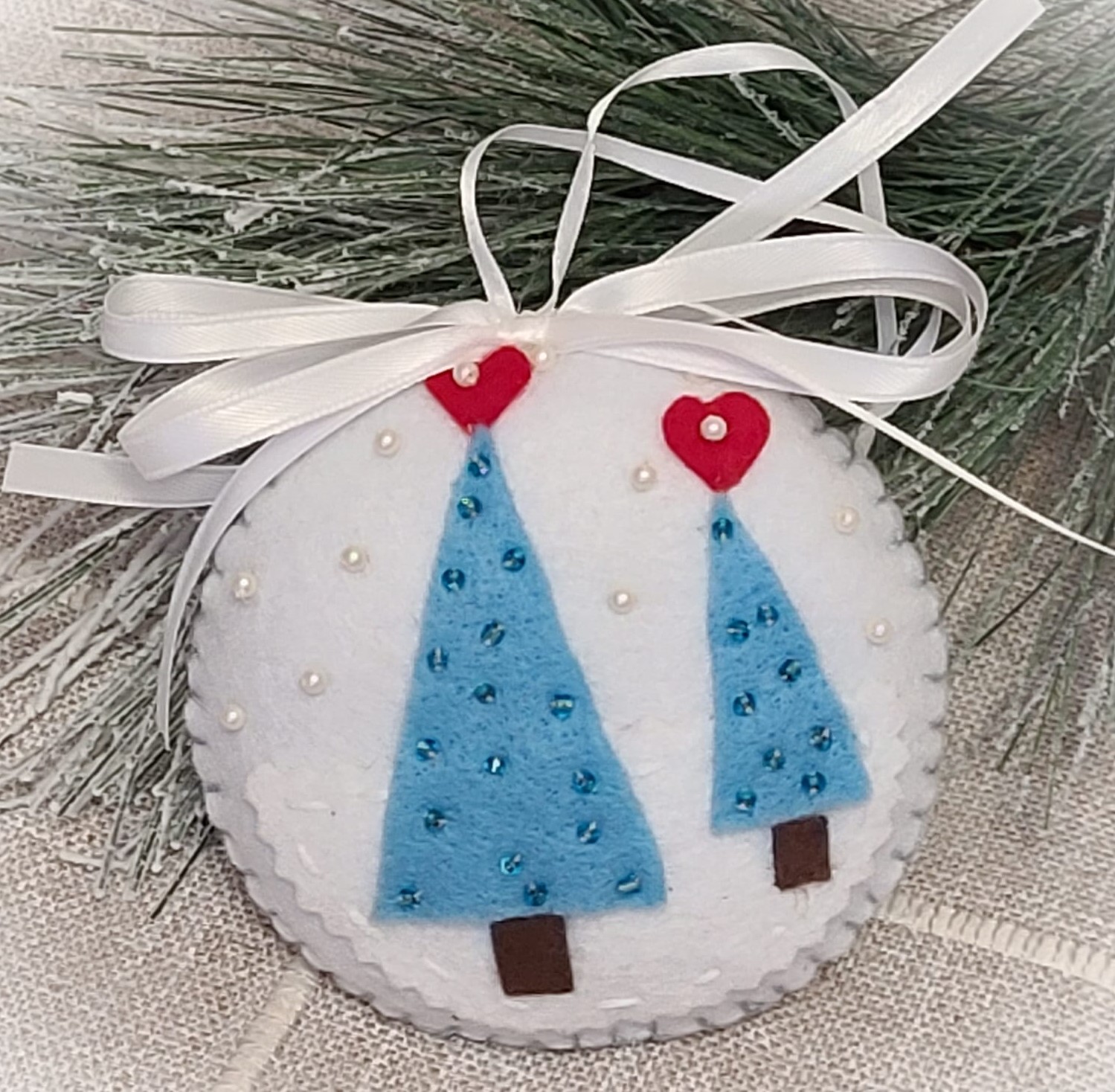 Felt and beaded evergreen trees round ornament - white & blue