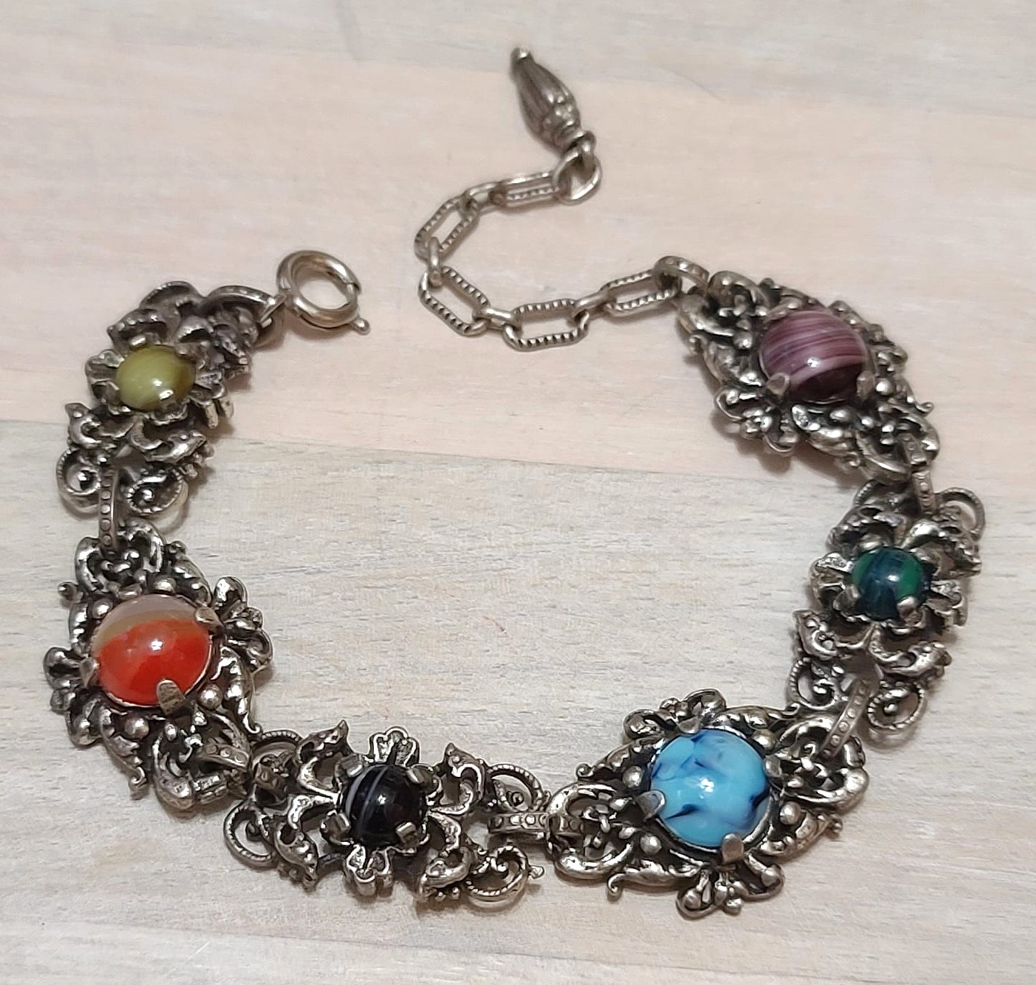 Vintage ornate bracelet, with multi color cabachons and filigree metal
