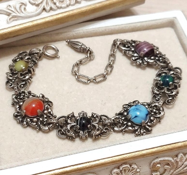 Vintage ornate bracelet, with multi color cabachons and filigree metal