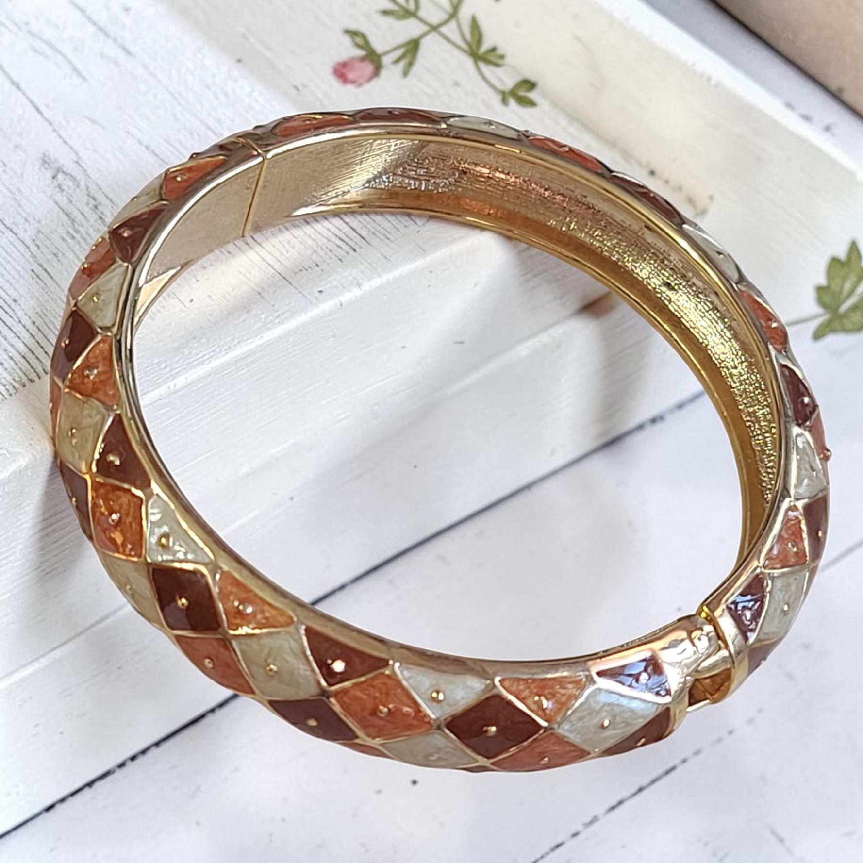 Enamel clamp bracelet, red and rust plaid pattern in goldtone setting