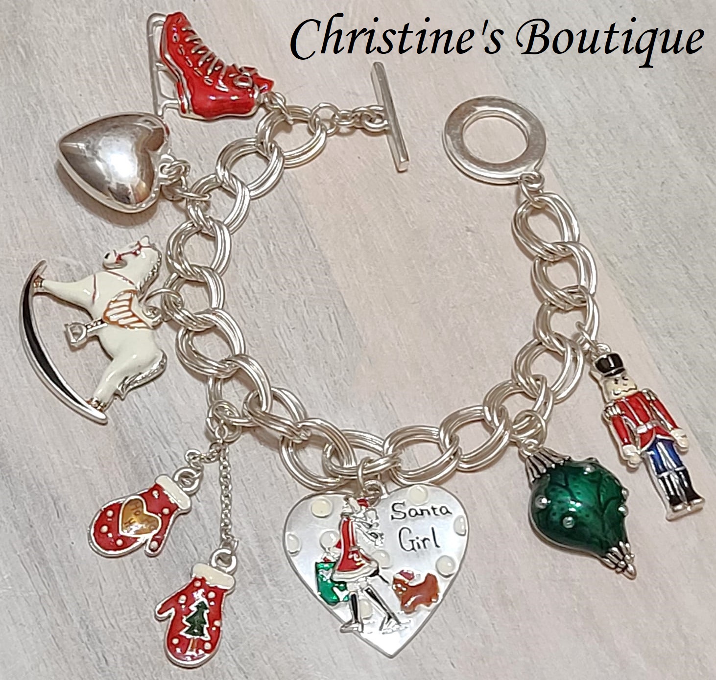 Christmas charm bracelet, ice skates, gloves, christmas heart, toy solider, rocking horse - Click Image to Close
