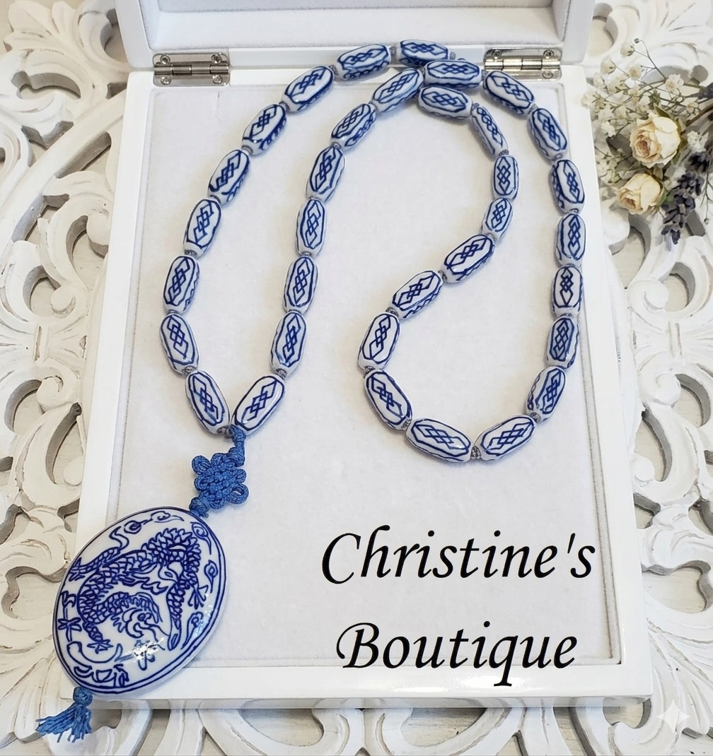 Asian ceramic beaded necklace with hanging dragon motif pendant