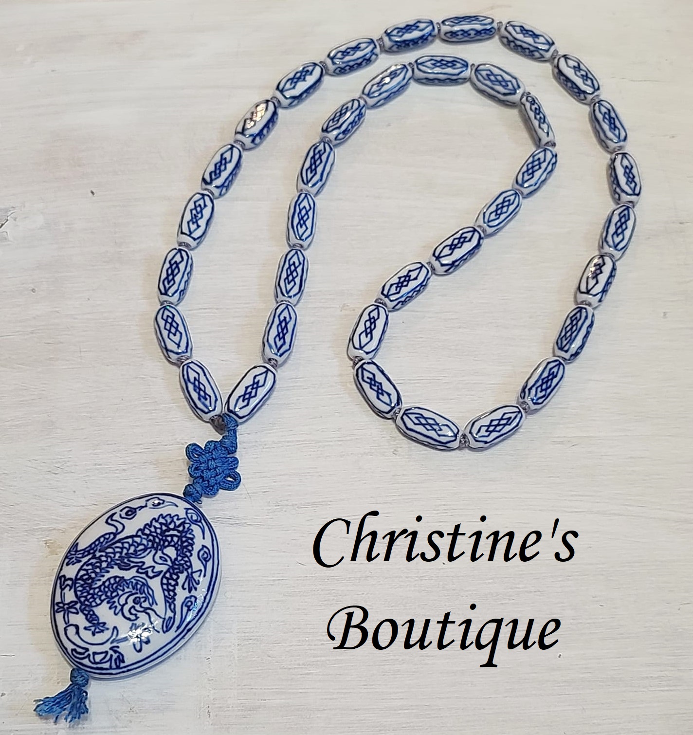 Asian ceramic beaded necklace with hanging dragon motif pendant - Click Image to Close