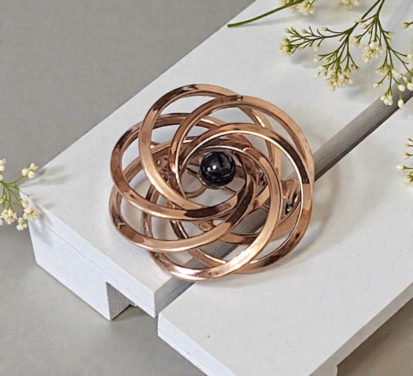 Copper pin, vintage with swirl effect, center black bead