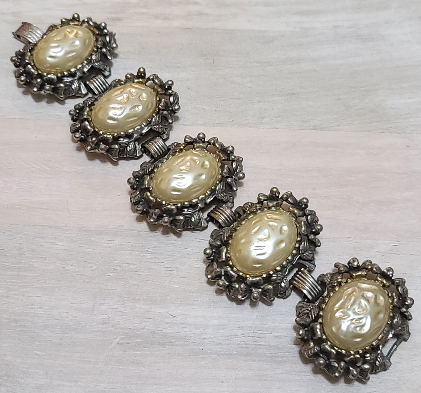 Repousse vintagee bracelet, ornate floral design with center cabachon links